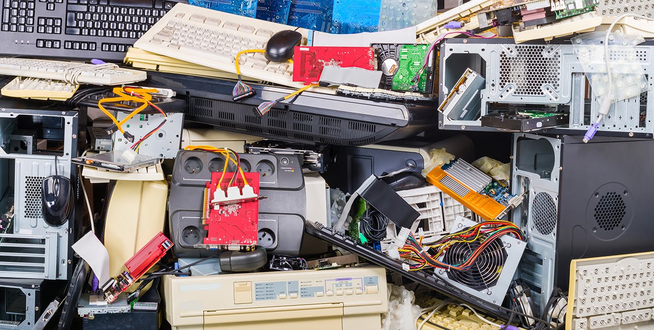 Electronic waste heap from used discarded computer parts and cases. Refuse sorting and disposal